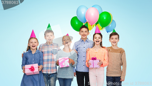 Image of happy children with gifts on birthday party