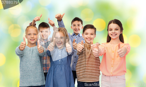 Image of happy children showing thumbs up