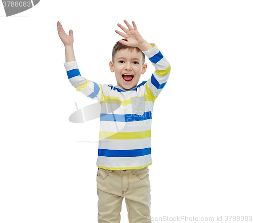 Image of happy little boy waving hands