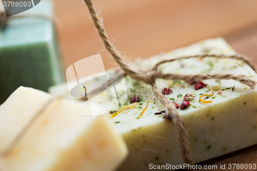 Image of close up of handmade soap bars on wood