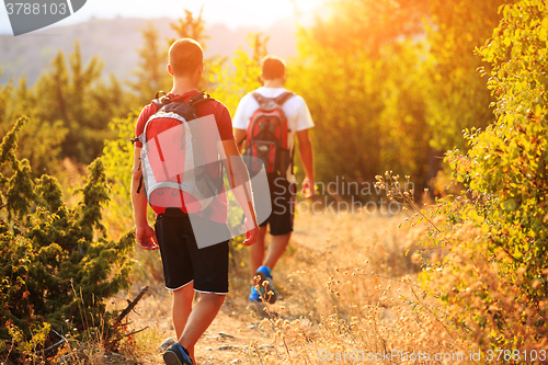 Image of Two backpackers in the summer mountain