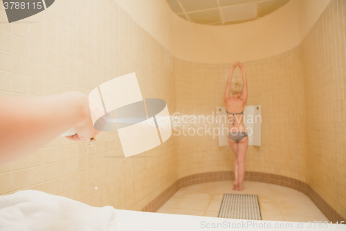 Image of Woman having high pressure massage with Sharko shower