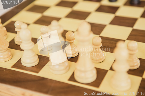 Image of Chess. White board with chess figures on it.