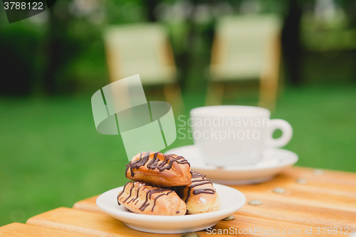 Image of Morning coffee. Cup coffee in park