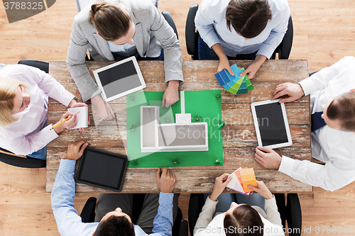 Image of close up of business team with project layout