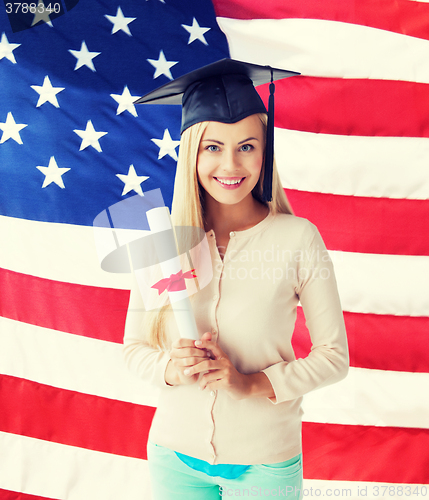 Image of student in graduation cap with certificate