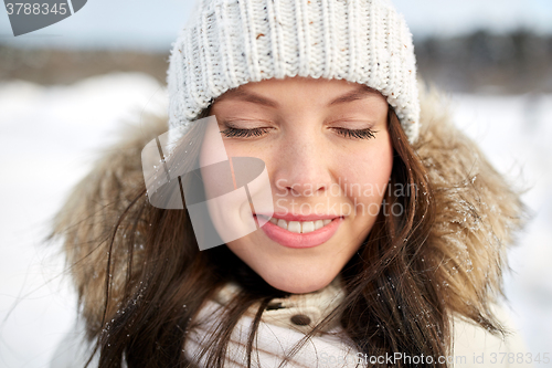 Image of happy woman outdoors in winter