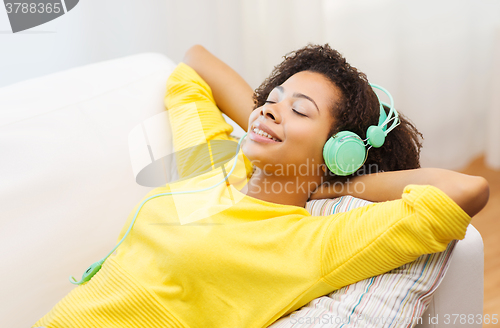 Image of happy woman with headphones listening to music