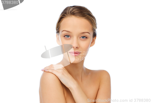 Image of smiling young woman face and shoulders