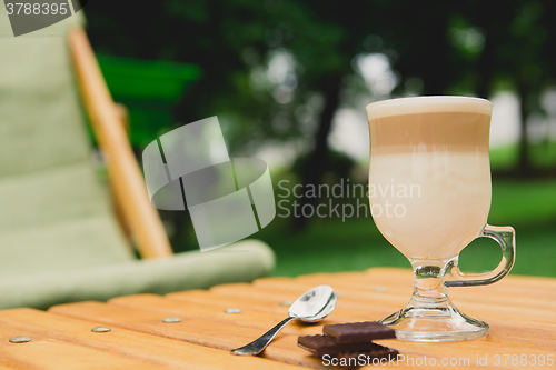 Image of Morning coffee. Cup coffee in park