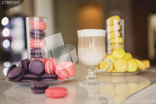 Image of Cup coffee in hotel with macaroons