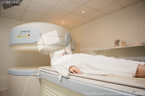 Image of Patient being scanned and diagnosed on a computed tomography