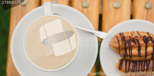 Image of Morning coffee. Cup coffee in park