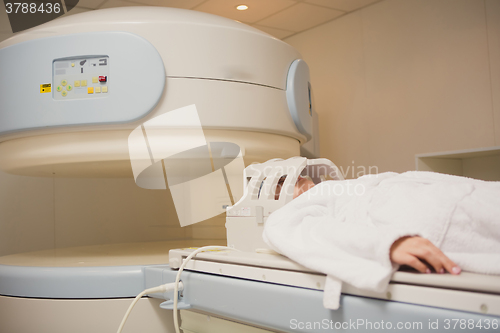 Image of Patient being scanned and diagnosed on a computed tomography