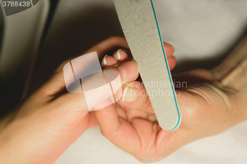 Image of Closeup shot of woman in nail salon 