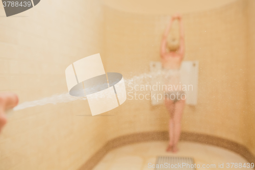 Image of Woman having high pressure massage with Sharko shower