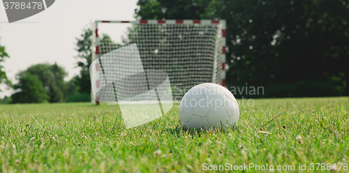 Image of Soccer ball on the green field