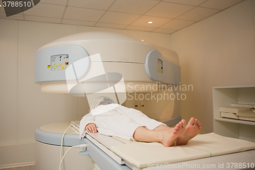 Image of Patient being scanned and diagnosed on a computed tomography