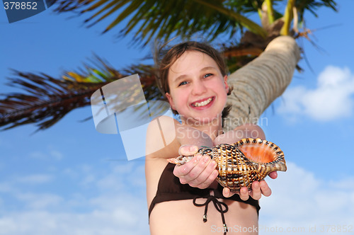Image of Young girl with seashell