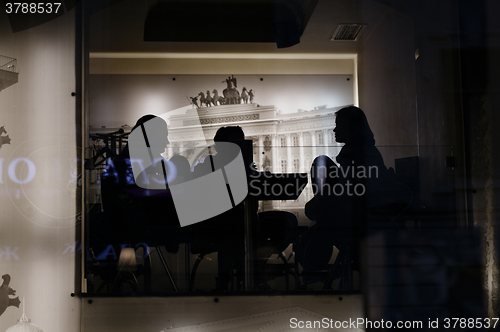 Image of Silhouettes of people in the cafe