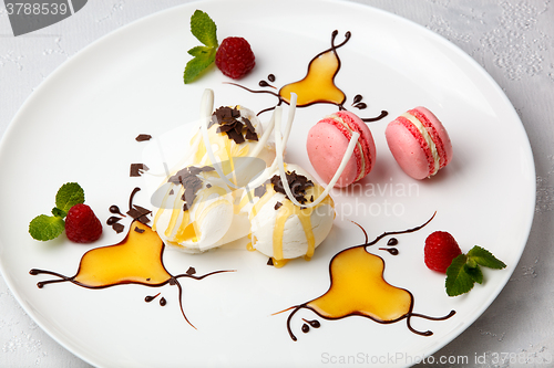 Image of Ice cream with macaroons and berries