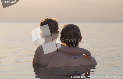 Image of Mother and son watching the sunset