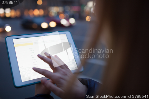 Image of Woman touching tablet screen