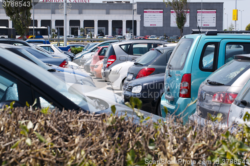 Image of Cars parked in an open-air car park