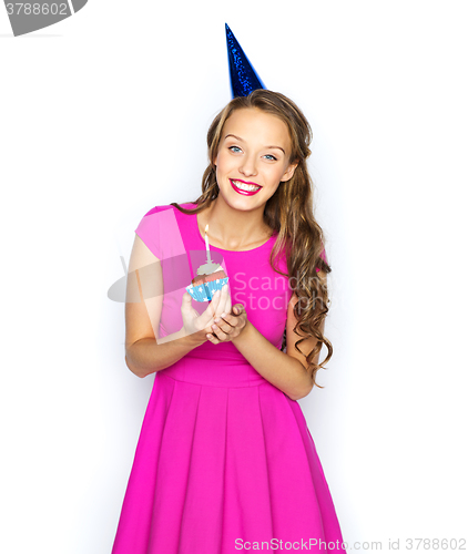 Image of happy woman or teen girl with birthday cupcake