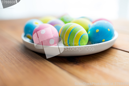 Image of close up of colored easter eggs on plate