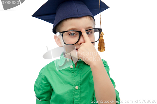 Image of happy boy in bachelor hat and eyeglasses