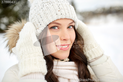 Image of happy woman outdoors in winter