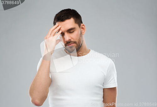 Image of young man suffering from headache