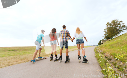 Image of teenagers with rollerblades and longboards