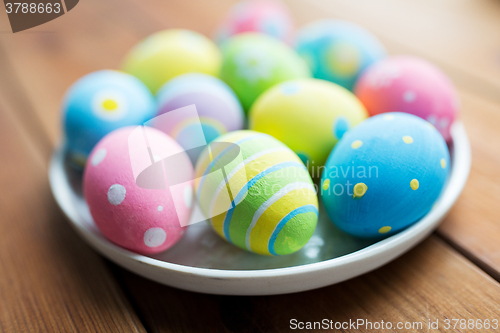 Image of close up of colored easter eggs on plate