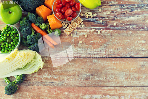 Image of close up of ripe vegetables on wooden table