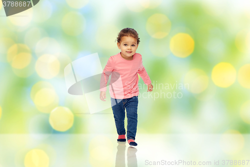 Image of little african american baby girl walking