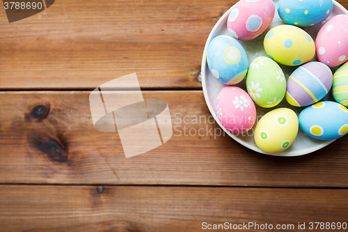 Image of close up of colored easter eggs on plate