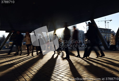 Image of People walking near the metro station.