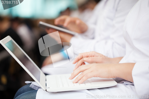 Image of Doctors with laptop and pad on the conference