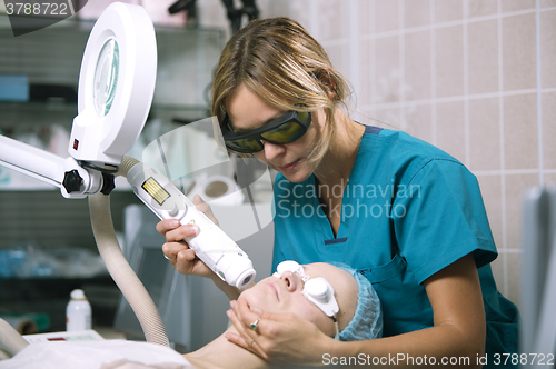 Image of Woman undergoing laser skin treatment