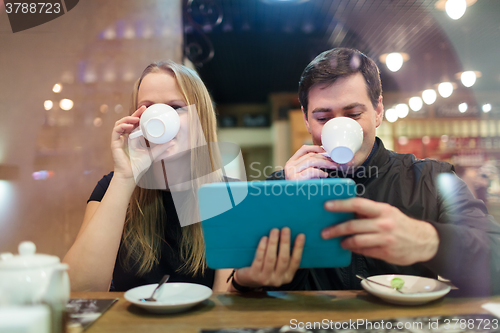 Image of Man and woman drinking coffee