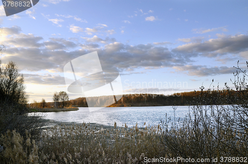 Image of Spring landscape with melting ice on the lake on a clear day