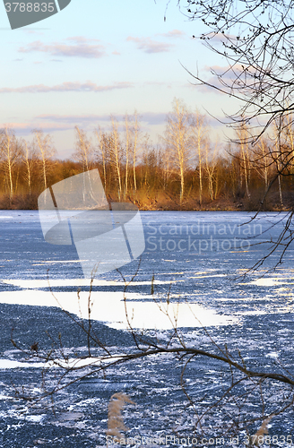Image of Nature background with spring landscape and melting ice at the l