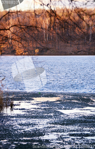 Image of Nature background with spring landscape and melting ice at the l