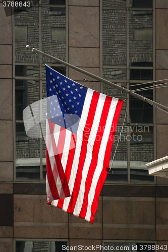 Image of American flag hanging on building