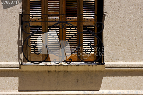 Image of old window grate and shadow 