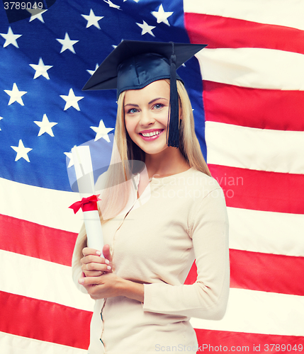 Image of student in graduation cap with certificate