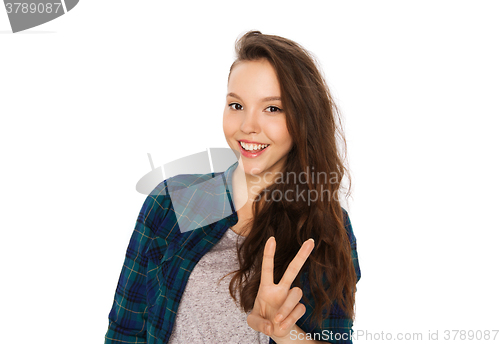 Image of happy smiling teenage girl showing peace sign