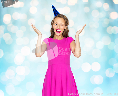 Image of happy young woman or teen girl in party cap
